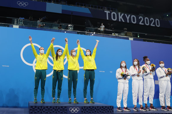 Australia’s 4 x 100m women’s freestyle relay team accept their gold medals at the Tokyo Olympic Games in July.