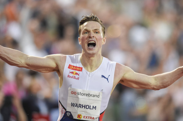 Karsten Warholm celebrates after breaking an almost-three decade-old world record at the Diamond League meet in Oslo.