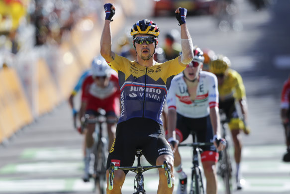Slovenia's Primoz Roglic celebrates as he crosses the finish line to win the fourth stage of the Tour de France.