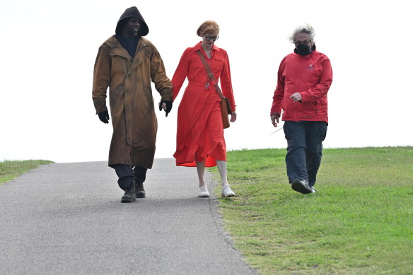 Miller on the set of Three Thousand Years of Longing, with Idris Elba and Tilda Swinton.