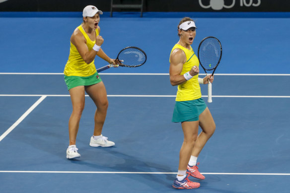 Ashleigh Barty, left, and Sam Stosur, right, celebrate at April's Fed Cup world group semi-final against Belarus. 