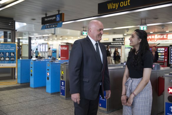 Transport Minister David Elliott and  nursing student Janki Patel at Parramatta station on Thursday.