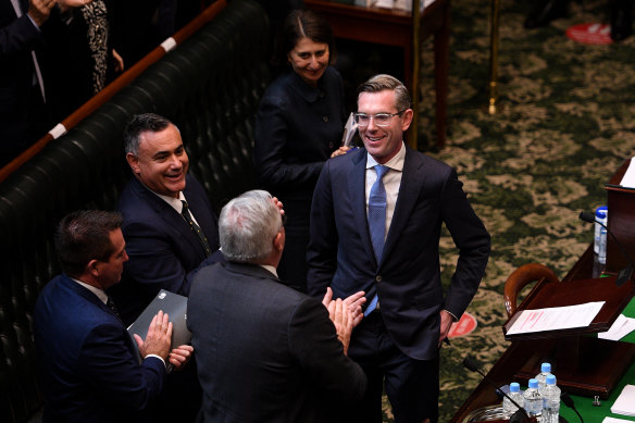 NSW Treasurer Dominic Perrottet is congratulated by NSW Premier Gladys Berejiklian, Deputy Premier John Barilaro, Deputy Nationals leader Paul Toole and Health Minister Brad Hazzard after delivering the State Budget speech at Parliament.