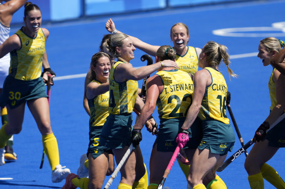 Australia’s Tatum Stewart, centre, celebrates the second Hockeyroos goal against South Africa.