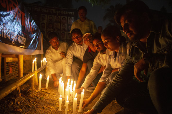 India’s opposition Congress party’s youth wing activists pay tribute to the victims of Sunday’s bridge collapse in western Gujarat state by lighting candles in Delhi, India.