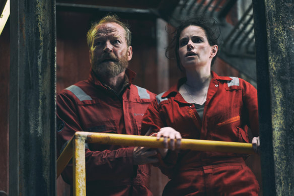 Iain Glen as Magnus and Emily Hampshire as Rose on board the Kinloch Bravo oil rig.