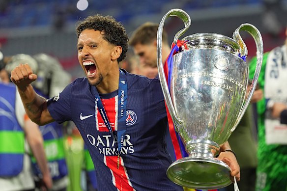 PSG's Marquinhos Celebrates with the Champions League's Trophy to the allianzing aren in Monaco.