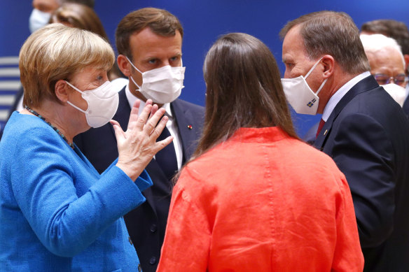 German Chancellor Angela Merkel and French President Emmanuel Macon. Leaders of the 27 members of the European Union agreed on a stimulus package in response to the coronavirus pandemic after nearly five days of acrimonious negotiations.
