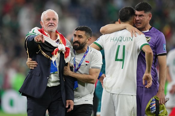 Iraq’s coach Graham Arnold celebrates World Cup qualification.