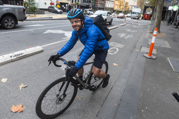 Travis Wade, cycling in a protected bike lane, on Friday morning.