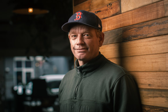 Australian cricket coach Andrew McDonald, with Boston Red Sox cap, at home in Geelong.