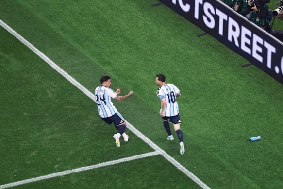Enzo Fernandez celebrates the moment with Messi.