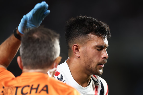 Joseph Suaali’i leaves the field on Friday night after taking a knock to the head.