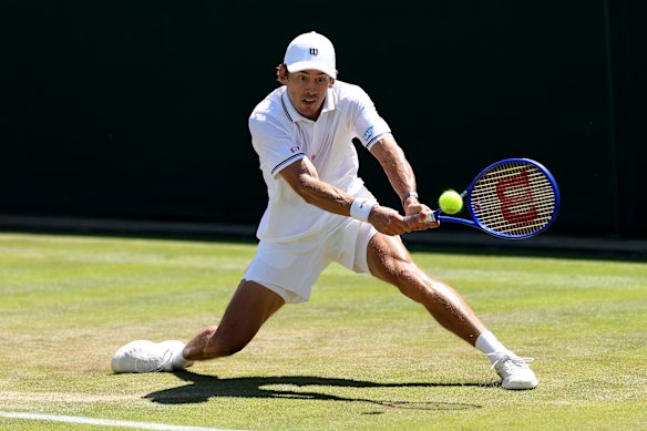 Alex De Minaur plays a backhand.