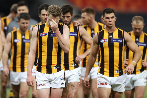 The Hawks leave the field looking dejected after a round five loss to GWS. 