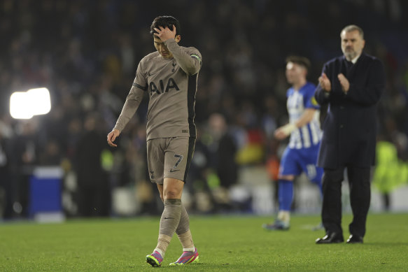 A dejected Son Heung-min and Ange Postecoglou leave the turf after Spurs’ heavy loss to Brighton.