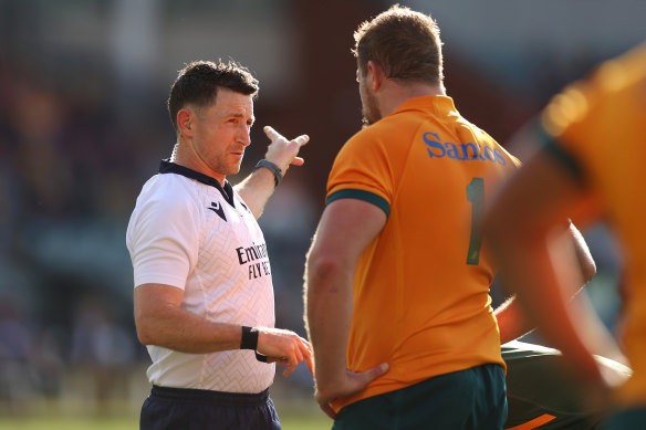 Referee Paul Williams talks with James Slipper in Adelaide.