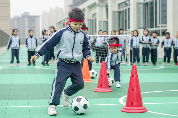 Kindergarten children play football games to celebrate World Football Day (December 10) in Huzhou, China.