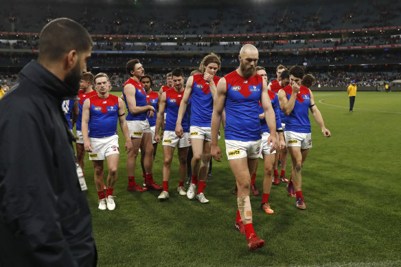 A dejected Melbourne leave the MCG.