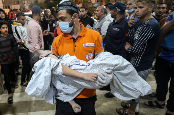 Palestinians injured in Israeli air raids arrive at Nasser Medical Hospital in Khan Yunis.