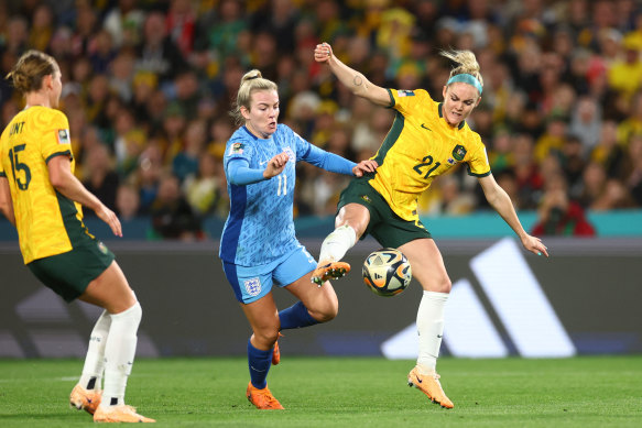 England’s Lauren Hemp gets past Ellie Carpenter (right) before scoring her side’s second goal.