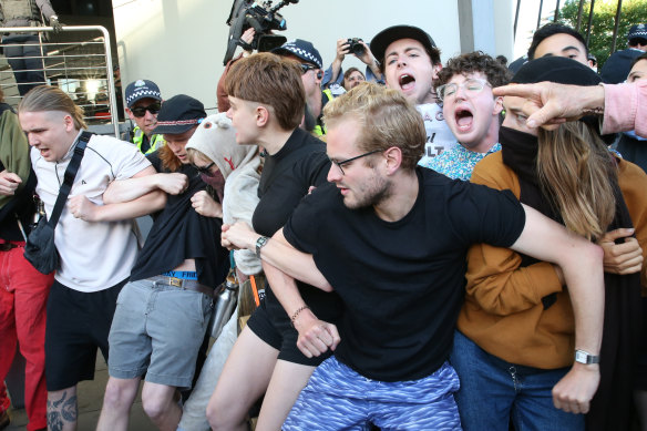 Protesters try to stop delegates entering the International Mining and Resources Conference in Melbourne on Wednesday.