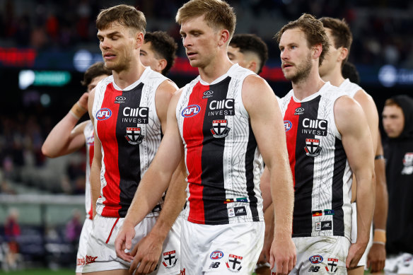 Seb Ross, middle, walks off the ground with St Kilda at a loss in May.