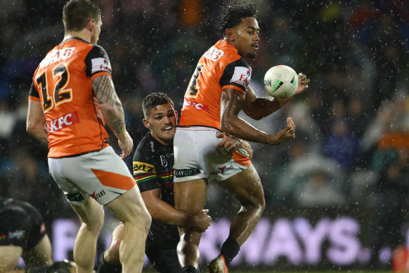 Jahream Bula gets an offload away against Nathan Cleary’s Panthers.