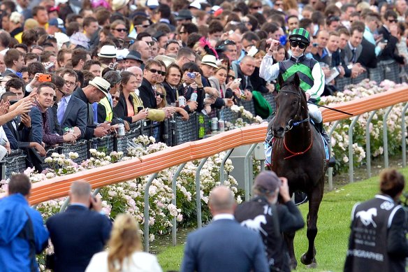 Chad Schofield returns to scale after winning the Cox Plate as an apprentice aboard Shamus Award in 2013.