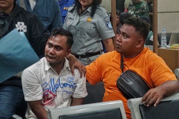 People wait for news of their loved ones after a ferry disaster on the way to Bali.