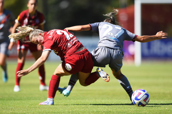 Emily Hodgson of Adelaide United tangles with India-Paige Janita Riley during their round 13 A-League Women’s match.
