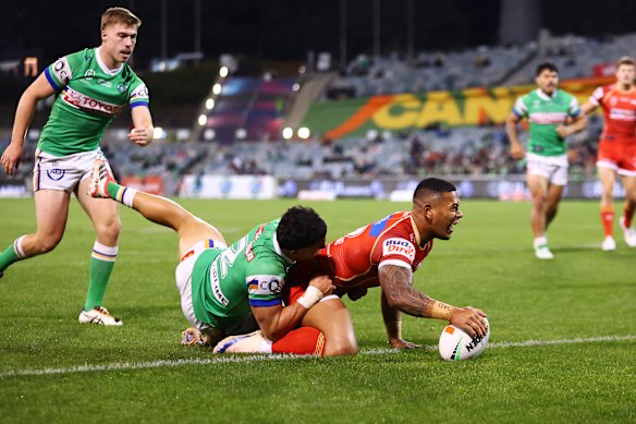 Jamayne Isaako scores a try for the Dolphins.