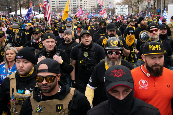 Demonstrators wearing Proud Boys attire during the protest march in Washington, D.C. on Saturday. The protests there, and in Washington state, later turned violent. 