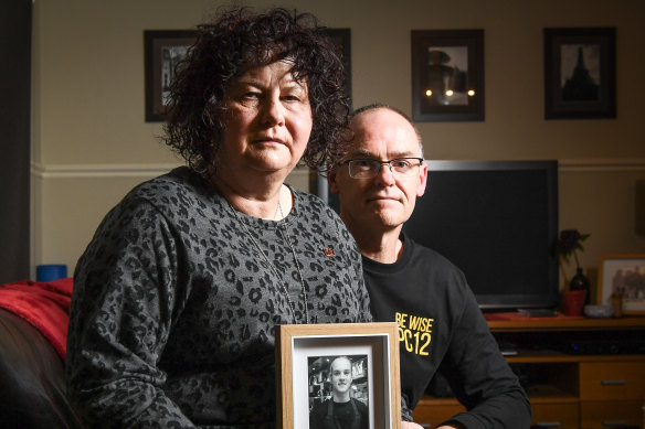 Robyn and Matt Cronin with a photograph of their son, Pat in 2018.