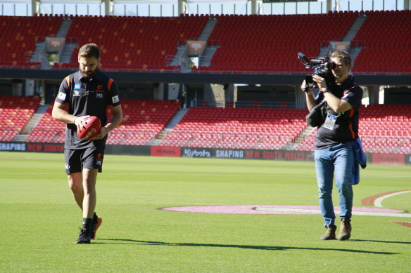 An Amazon camera crew tracks Stephen Coniglio for the documentary on the GWS Giants that will be released next year.