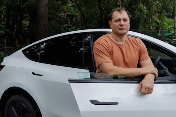 Alex Pisarev with his Tesla Model Y in Sydney