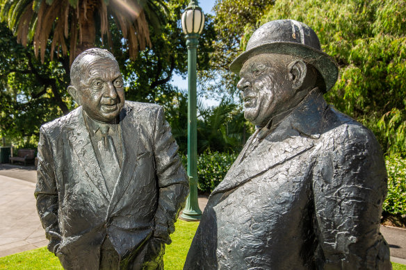The statues of Sir Henry Bolte (left) and Sir Albert Dunstan, side by side at Treasury Gardens in Melbourne.