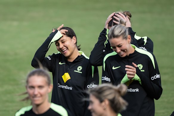 Kerr laughs with Matildas teammates during a training run.