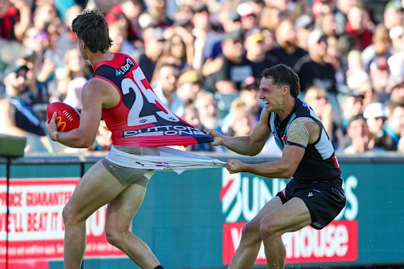 Got ya: Essendon’s Jaxon Prior comes under pressure.