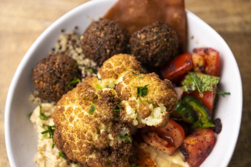 The Khamsa Cafe Jerusalem Bowl with hummus, baba ghanoush, quinoa, fattoush, falafel and cauliflower. 