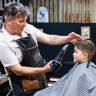Soren Soltani having his haircut at Barbriko by owner Nicolaos Vlahos in North Sydney. 16th June 2022. Photo: Edwina Pickles / SMH