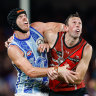 North’s Tristan Xerri goes up in the ruck against his former mentor, Todd Goldstein, now with the Bombers.