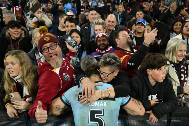 Zac Lomax with his mum after Origin II at the MCG.