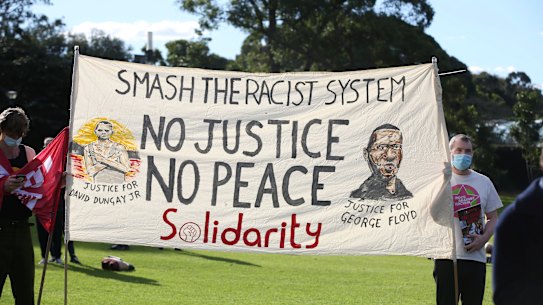 A banner at the Black Lives Matter rally in The Domain.