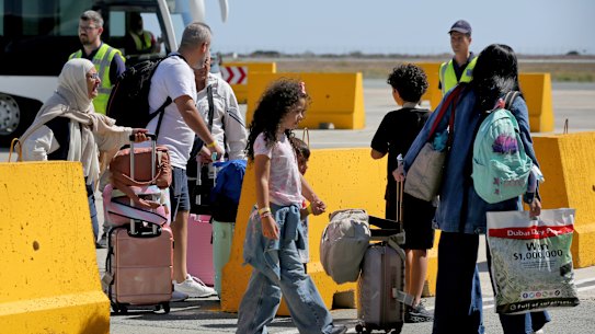 Australian nationals evacuated from Lebanon arrive at Larnaca International Airport.