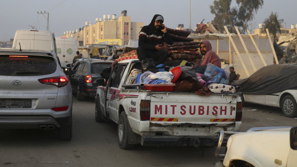 Palestinians fleeing the Israeli bombardment of the Gaza Strip arrive in Rafah, near the border with Egypt.