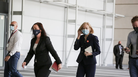 Queensland’s Health Minister Yvette D’Ath and chief health officer Jeannette Young arrive at Monday’s media conference in the Brisbane Convention and Exhibition Centre.