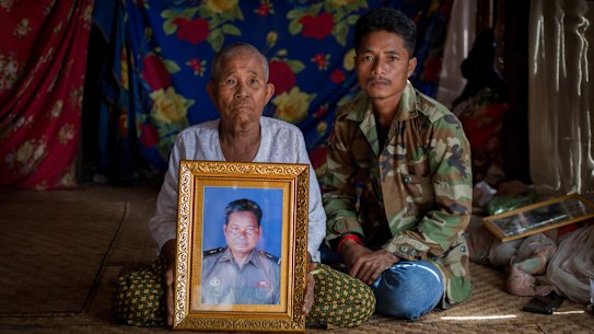 Suon Roun’s mother, Em Heap, and brother Suon Eung inside their home at Kampenh village in Cambodia. 