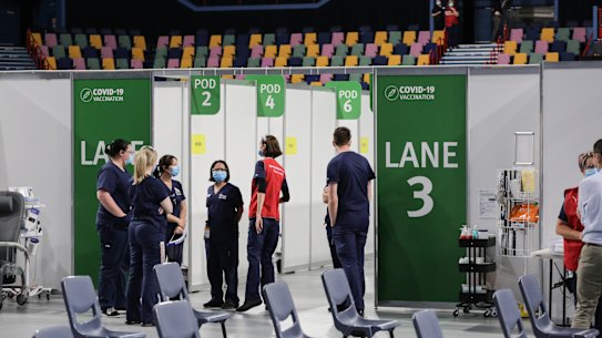 Staff at the Brisbane Entertainment Centre mass vaccination hub at Boondall, in the city’s north.