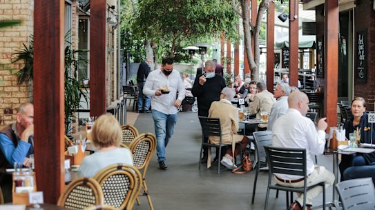 The lunch crowd at Brisbane’s Breakfast Creek Hotel in August. From December 17, such venues will be able to operate without density restrictions if all patrons and staff are vaccinated.